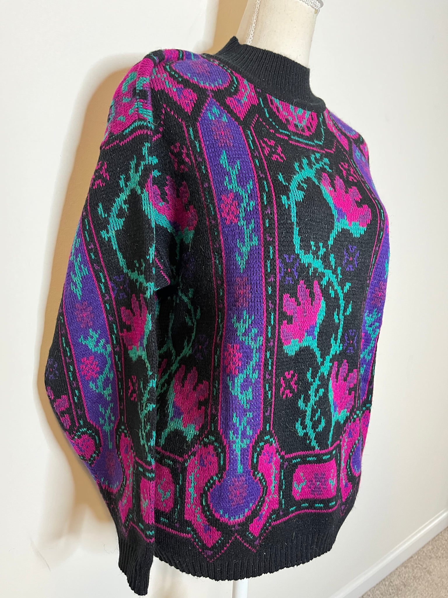 Mock neck w/ elastic band at waist Jewel tone sweater with floral design